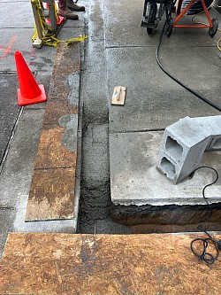 Another view of concrete footers and rebar being installed.