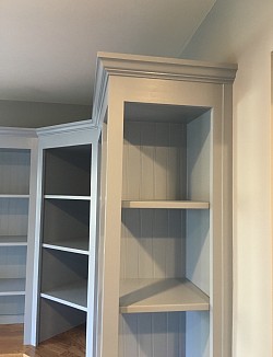 We installed beadboard backs in the upper shelving cabinets. The crown molding at the top is a nice touch that draws the eyes upwards.