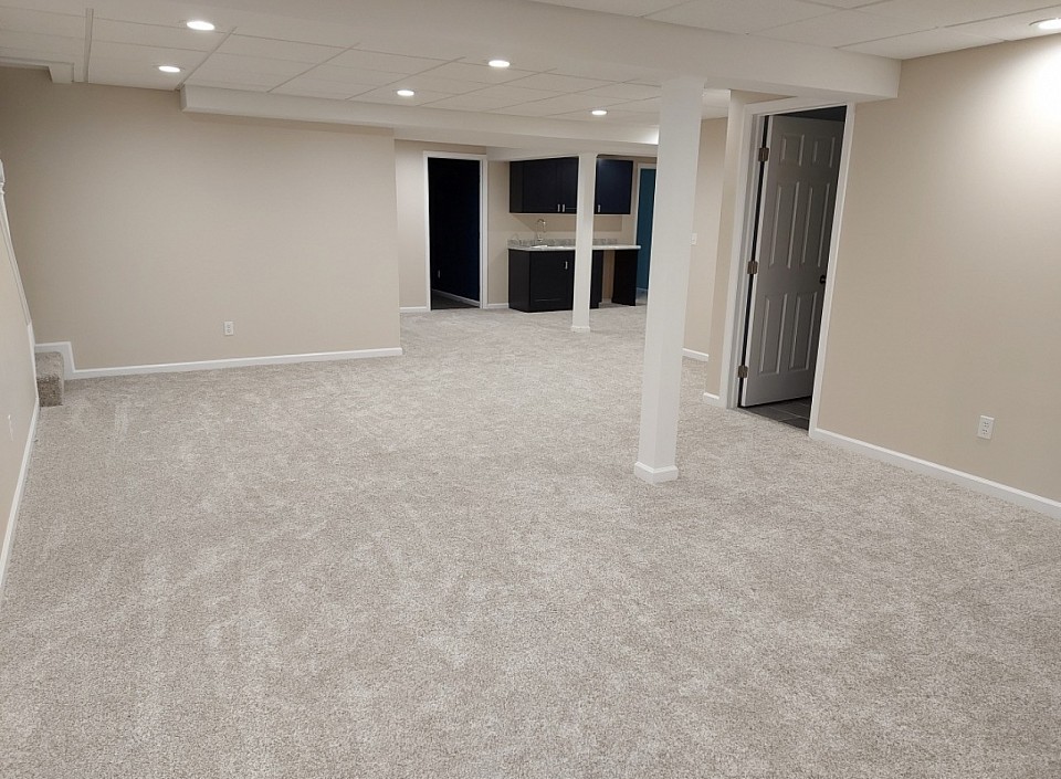 We took this pic right after the carpet was just installed. Who doesn’t love brand new carpet! And a brand new finished basement!